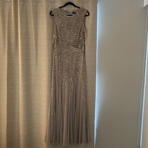 Evening Elegant long dress  Très chic design Grey sequence with a flair bottom .